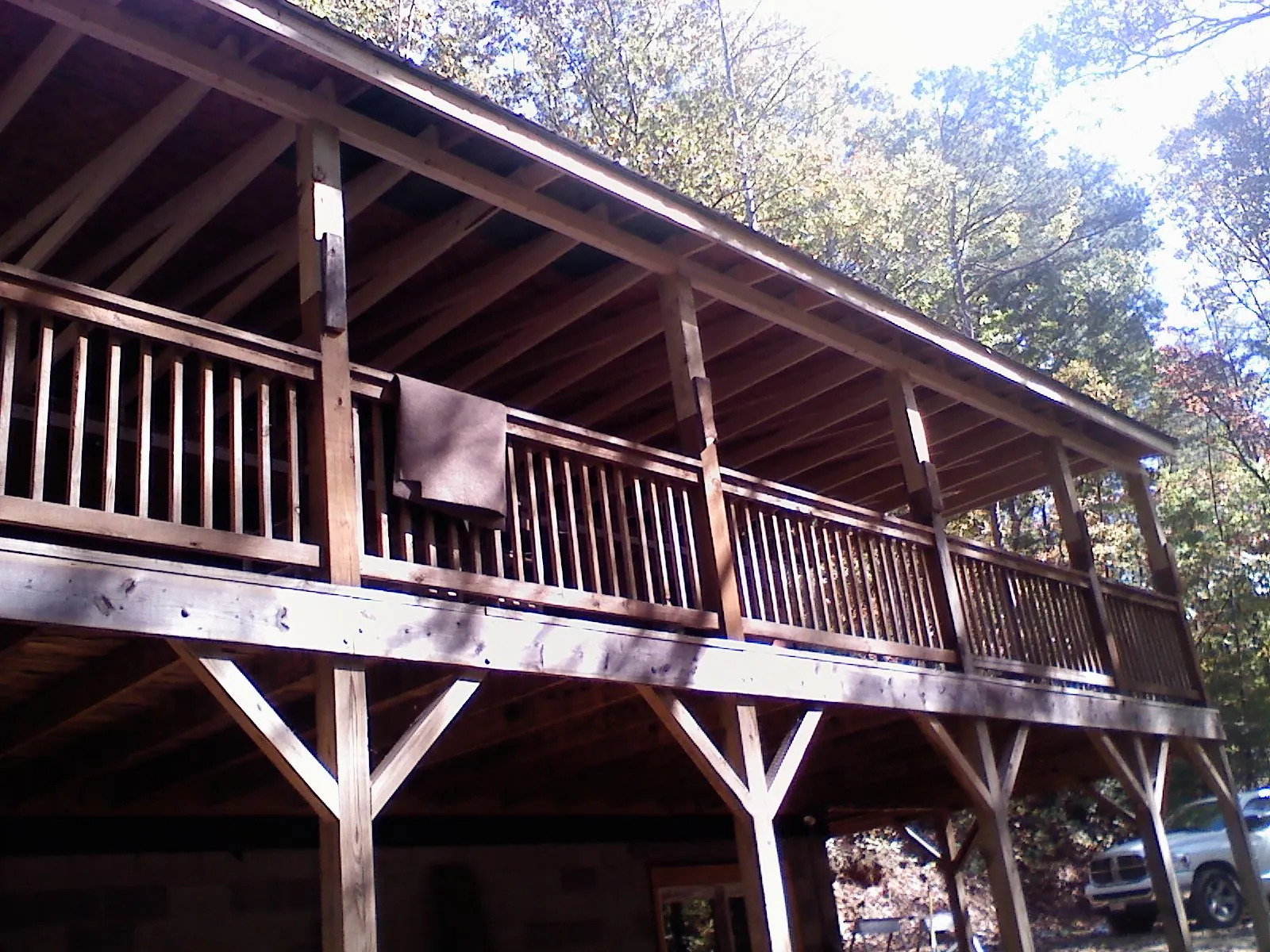 Timber framing under a new elevated porch and deck — Roof Leak Repair in Manchester Center by Roofing Brothers